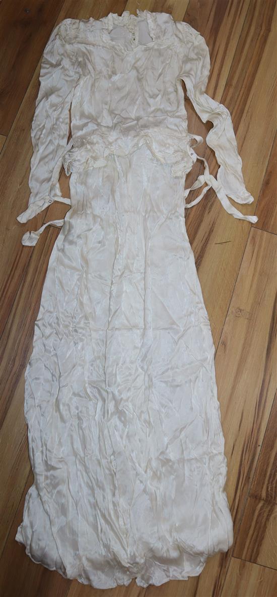 A 1930s white satin wedding dress and later veil